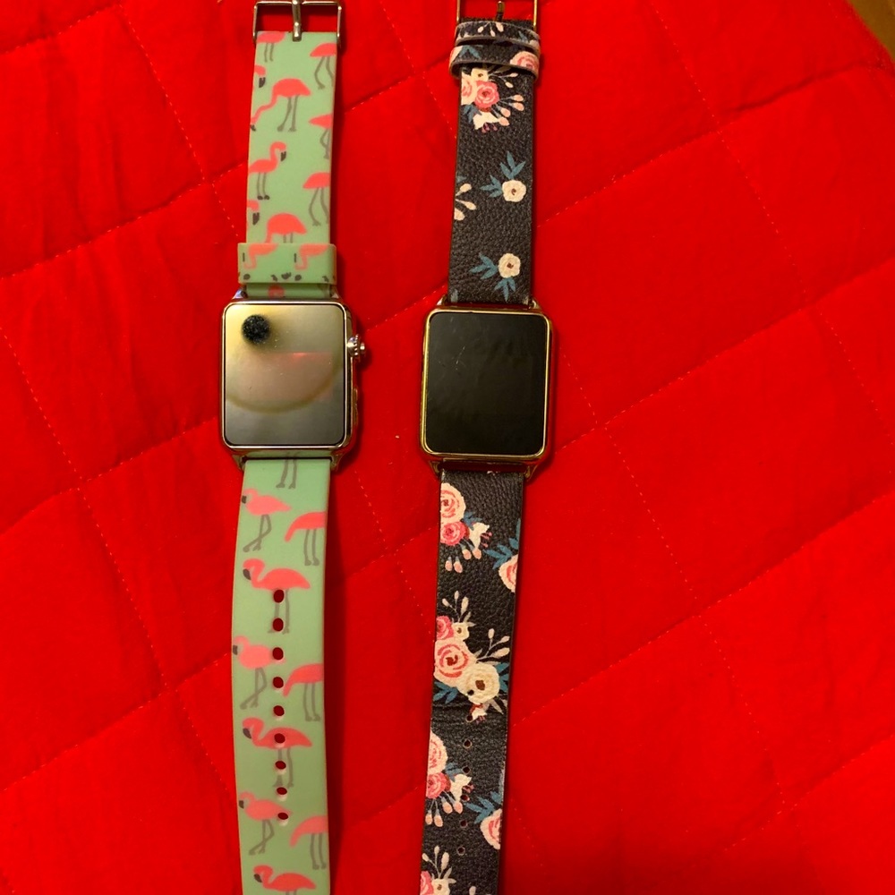 2 digital watches that tell time when tap on them